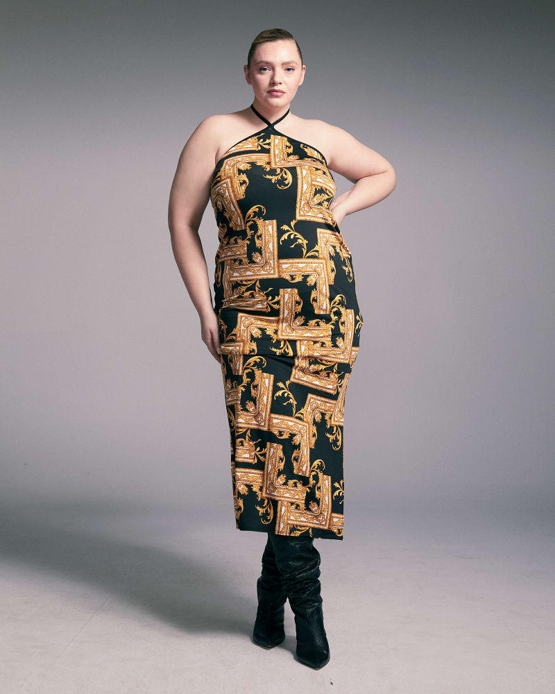 Front of a model wearing a size 1X Xandra Halter Neck Maxi Dress in Black/Gold by L I V D. | dia_product_style_image_id:272713